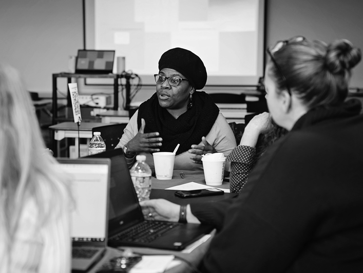 Woman speaking, grayscale photo