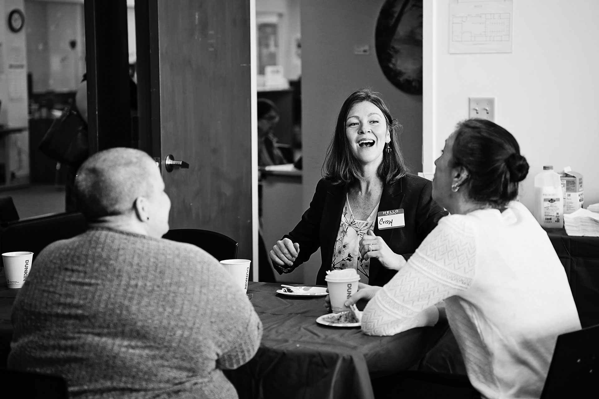 three people sitting around a table